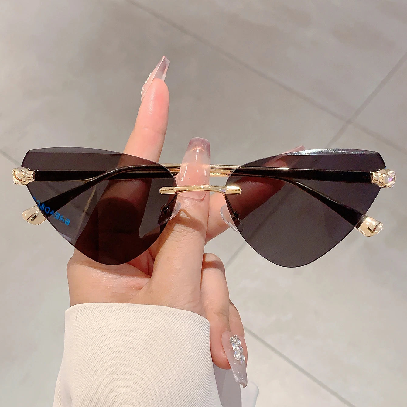 Women's Retro Metal Rimless Triangle Sunglasses