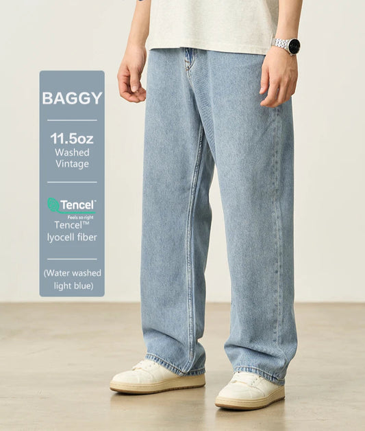 Person wearing light blue baggy jeans with SIMWOOD branding on a white background